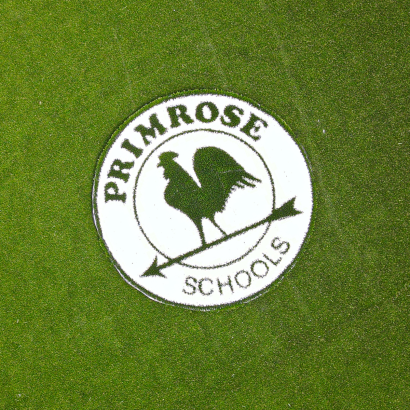 Primrose Schools logo AST Ameriplay on artificial turf playground surface Atlanta GA