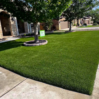 Lush green AST Supreme-60 artificial grass installed in residential front yard in San Antonio, TX