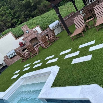 Elegant outdoor living space Toccoa Georgia with jacuzzi, seating area, and artificial grass - American Syn-Turf Supreme-60 premium synthetic lawn for pool decks and patios