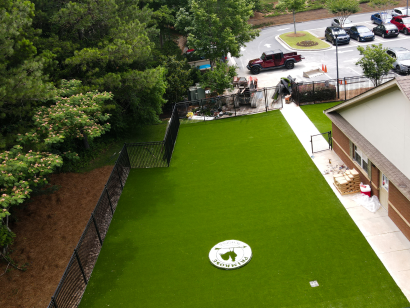 Artificial grass installation at Primrose Schools playground in shaded outdoor area Atlanta GA AST Ameriplay