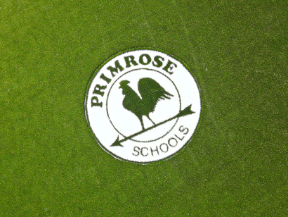 Primrose Schools logo AST Ameriplay on artificial turf playground surface Atlanta GA