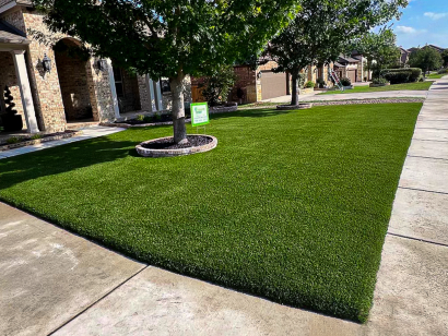 Lush green AST Supreme-60 artificial grass installed in residential front yard in San Antonio, TX