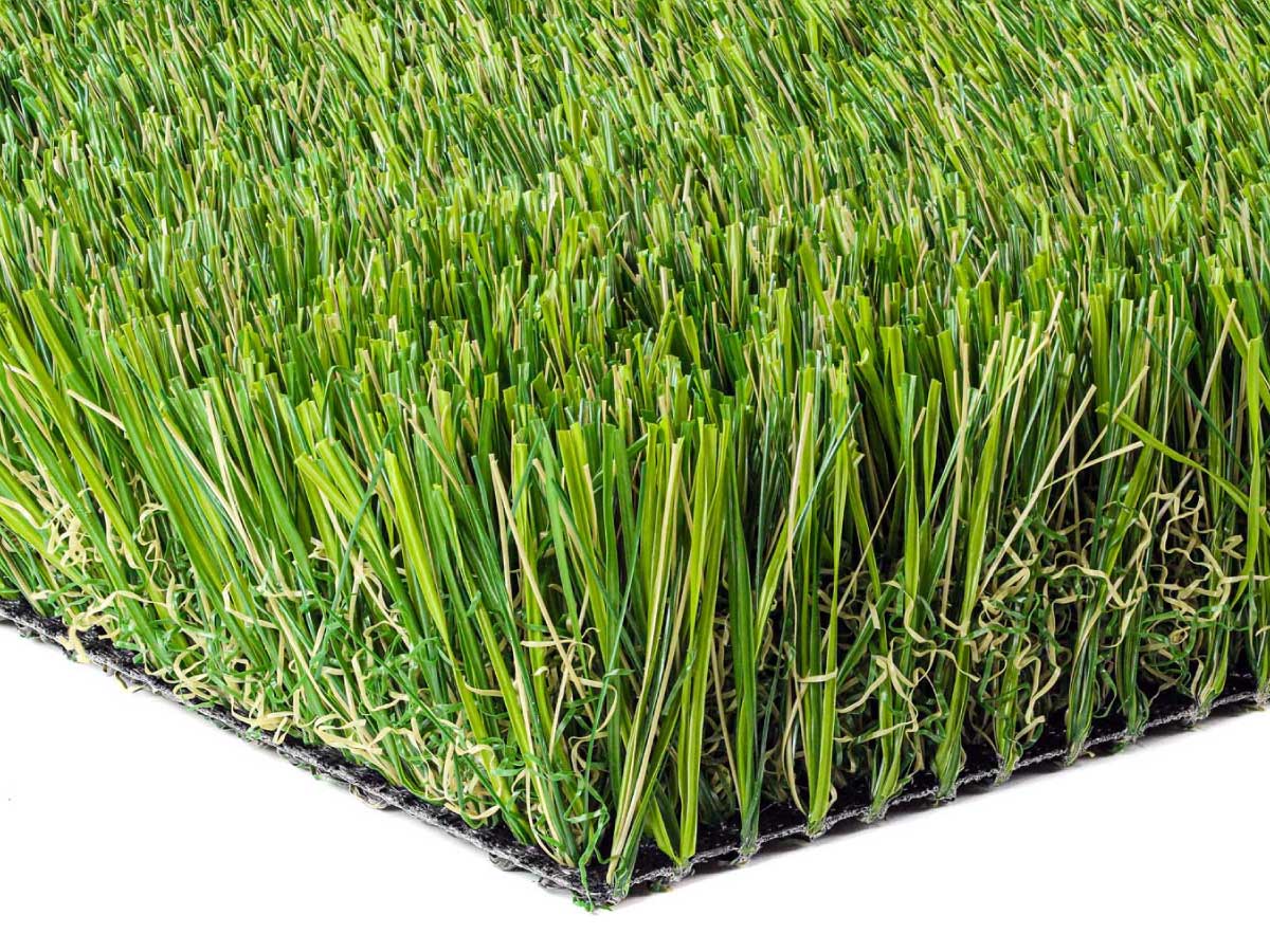 Angled view of Epic Max Permeable synthetic grass, American-made, highlighting vibrant blades.